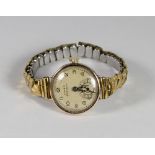 A lady's Rolex Precision wristwatch in a 9ct. gold case, on a gold plated expanding bracelet