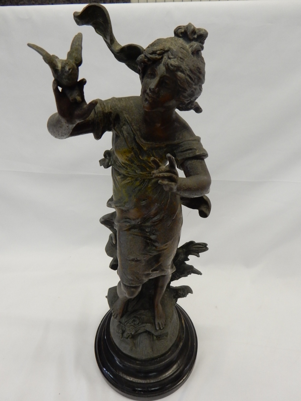 An Edwardian spelter figure of an Art Nouveau lady with a bird on her hand, on ebonised base - 19