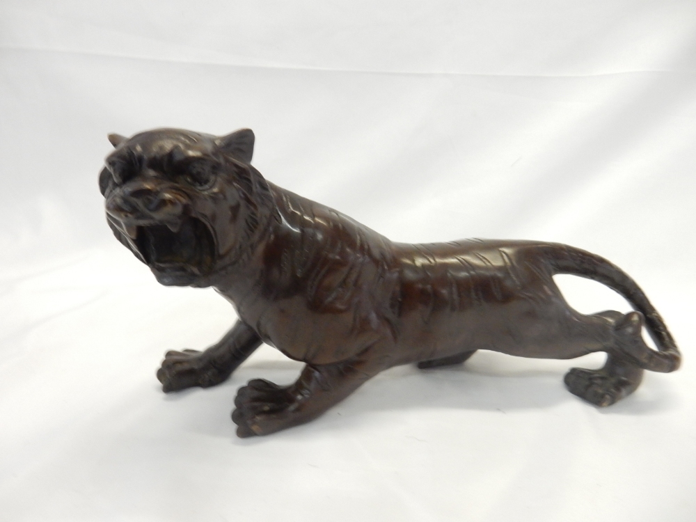 A Japanese bronze model of a snarling tiger - 12in. long