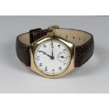 A wristwatch with white enamel dial, seconds dial, in a 9ct. gold case, on a leather strap