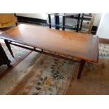 A teak table with rectangular top, on turned tapering legs - 48in. x 20in.