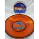 A Poole Pottery limited edition charger, no.311 of 1000, orange with a dolphin to the centre,