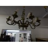 An eight branch chandelier with scroll arms