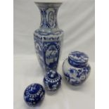 A Chinese vase of panelled form decorated figures, birds and animals in reserves, two Chinese blue