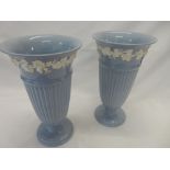 A pair of Wedgwood blue vases with flared necks, a decorative porcelain part tea service and an