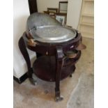 A copper and rosewood restaurant carving trolley, on four legs with castors - 37in. high