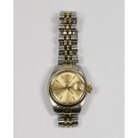 A lady's Rolex Oyster perpetual date wristwatch with champagne dial, in a bi colour 14ct. gold and