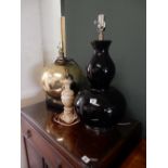 A large black glazed double gourd style tablelamp base - 22in. high, a large gilded tablelamp base