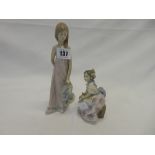 Two Lladro figures of a girl in pink dress and hat - 8 1/2in. high and a seated girl in