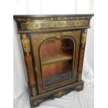 A 19th Century red buhl cabinet with gilded caryatids, shaped glass door enclosing shelves, on