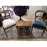 A nest of three oak framed occasional tables, on turned legs, a Victorian dining chair with