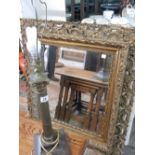 A brass tablelamp base with Corinthian column, complete with shade and a large bevelled wall