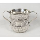 A George II silver porringer with half fluted decoration, engrave initials to the cartouche-