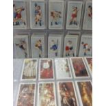 An album of cigarette cards including State Express Cigarettes Speed Land Sea and Air and Sports