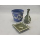 A selection of Wedgwood green jasper pin trays, a pair of bottle shaped vases and a pair of small