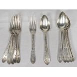 A set of six Victorian silver dessert spoons and forks with engraved decoration to the handles -