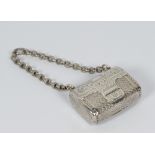 A George III silver purse shaped vinaigrette with buckle decoration and chain - London 1795
