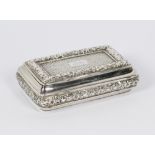 A George III silver cushion shaped snuff box with basket weave and repousse decoration of