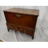 An antique Welsh style coffer with hinged lid and two drawers to the base - 24in. wide