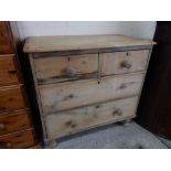 A pine chest fitted four drawers, on turned feet - 30in. wide