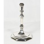 A Queen Anne silver taper stick of tapering panelled form, on octagonal base - London 1713 - 5in.