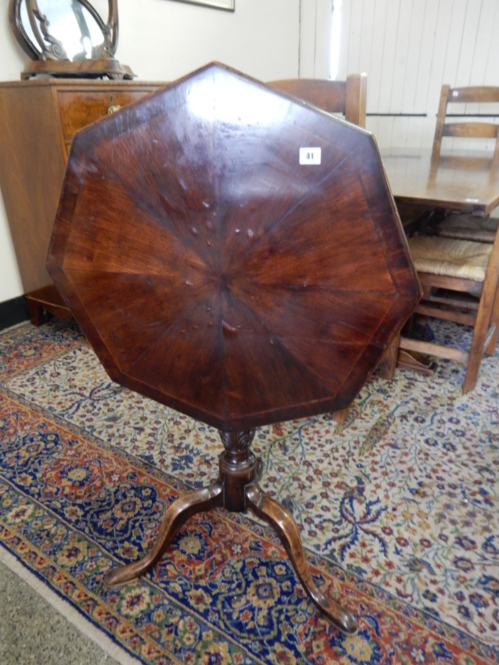 A 19th Century mahogany and crossbanded snap top table, on fluted and leaf carved column and three