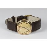 A gentleman's wristwatch, circular dial, seconds dial, in a square 9ct. gold case, on brown leather