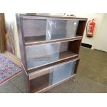 A three section bookcase with glass sliding doors - 36in. wide