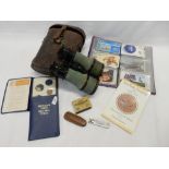 A pair of military binoculars in leather case, phone card collection etc..