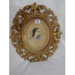 A Victorian watercolour in an oval - Head and shoulders of a girl, in a Florentine frame - 6 1/