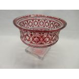 A large ruby flashed pedestal bowl - 10in. dia. and 8in. high, a water jug with etched decoration,