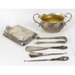 A silver double handled sugar basin, a pair of sugar tongs, a shoe horn and button hook with