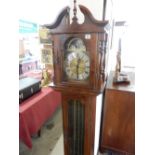 A reproduction Emperor Clock Co longcase clock with brassed dial, in a mahogany finished case