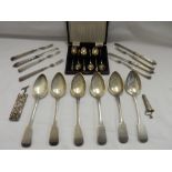 A case of six silver coffee spoons with Apostle terminals, five dessert forks with panelled handles,
