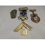 A silver gilt Masonic medal, one other enamel badge and one other badge