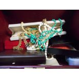 A selection of costume jewellery including simulated pearls, watch and earring set, in fitted box,