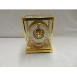 A Jaeger Le Coultre Atmos clock in a brass and glass case