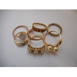 A lady's ring set with two pearls, on a 10kt. gold shank, a lady's ring set three opals and four