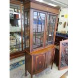 An Edwardian mahogany and inlaid display cabinet, the upper part with inlaid dentil style cornice,