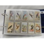 An album containing cigarette cards relating to wildlife including Carreras Dogs and Friend,