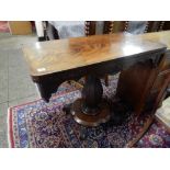 A William IV mahogany card table with rectangular folding top, shaped apron, on tapering baluster