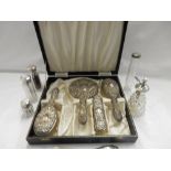 A lady's part silver mounted dressing table set in fitted case comprising:- hand mirror, pair of