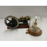 A Victorian style model of a steam engine with wheel and pump and one other model