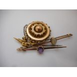 A Victorian gold target brooch, a 9ct. gold bar brooch set stone, a 9ct. gold bar brooch set