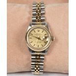 A lady's Rolex Oyster Perpetual Datejust wristwatch with champagne dial, on a bi colour 18ct. gold