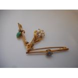 A 9ct. gold brooch set pearls and diamonds to flower and leaf design, a gold coloured metal bar