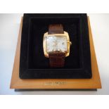 A gentleman's Baume and Mercier Hampton Spirit automatic wristwatch in an 18ct. gold case, on a