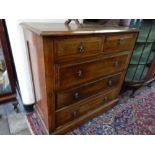 A walnut and inlaid straight front chest fitted two narrow and three wide drawers, on bracket feet -