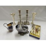 A pair of silver plated spill vases, a pair of Georgian design silver plated candlesticks, a