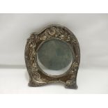 An Art Nouveau silver fronted photograph frame decorated with a lady and flowers - Birmingham